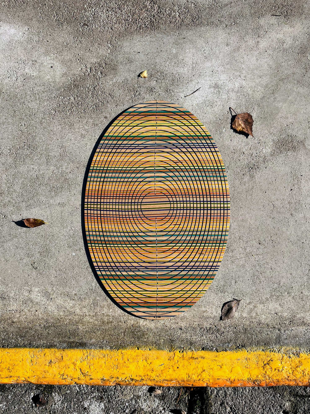Colourful oval cycloop made out of sustainable recycled skateboards